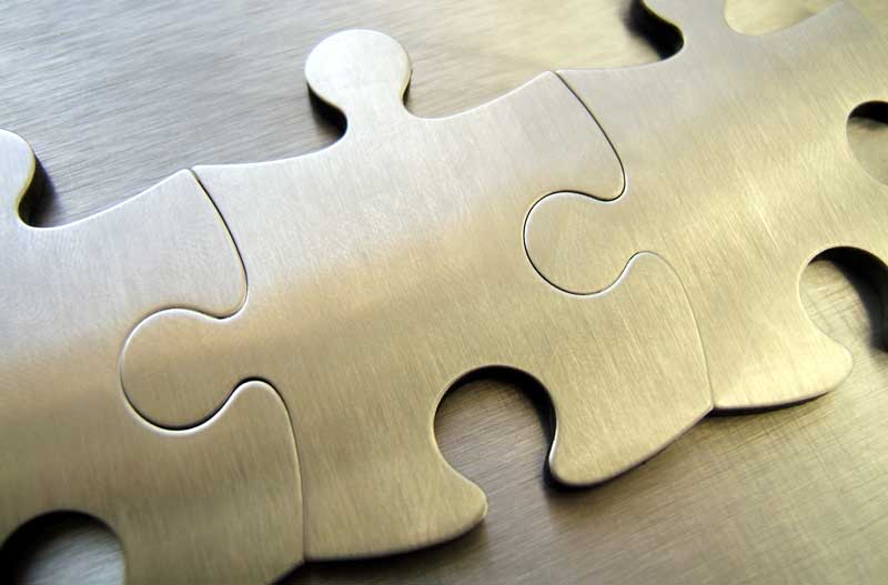 Metallic puzzle pieces, AEHI, Inc. management
